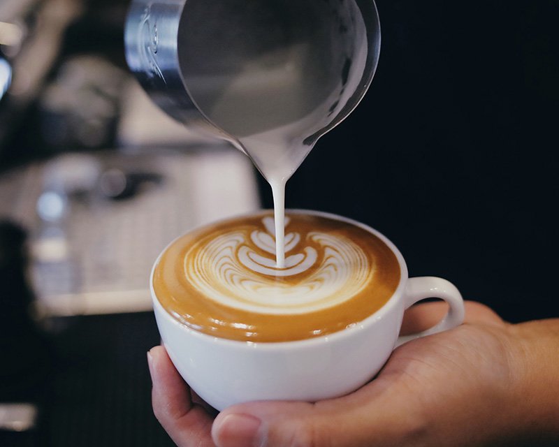 Barista pouring latte art